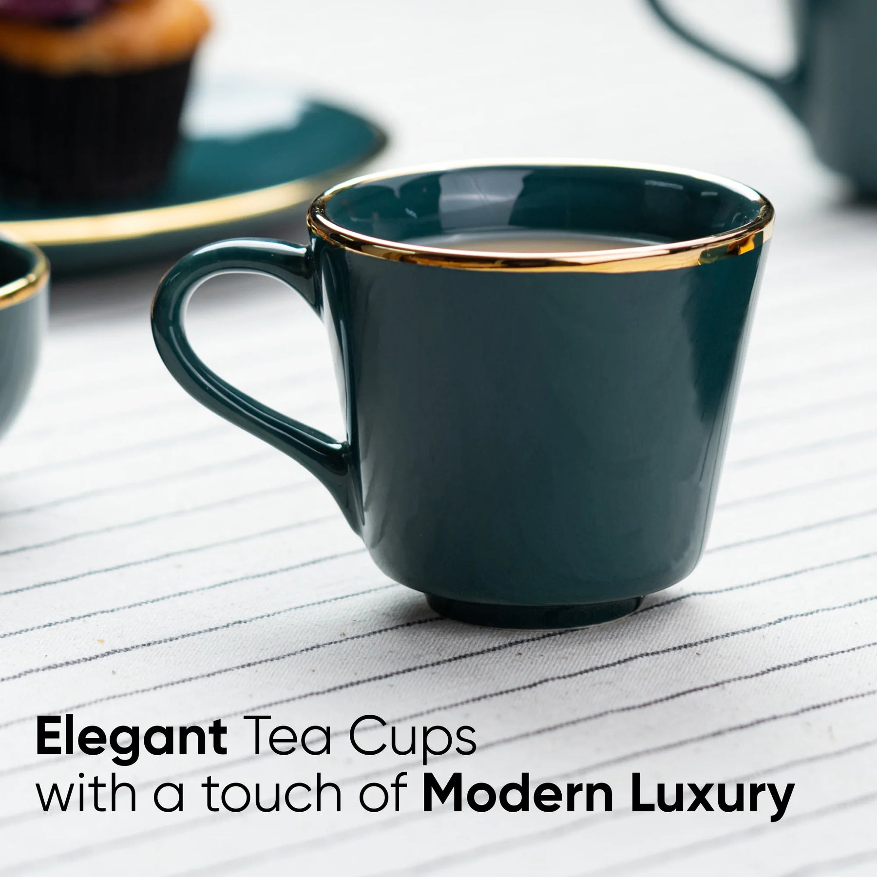 Dark green tea cup with gold rim on a white surface, text 'Elegant Tea Cups with a touch of Modern Luxury'.