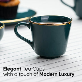 Dark green tea cup with gold rim on a white surface, text 'Elegant Tea Cups with a touch of Modern Luxury'.
