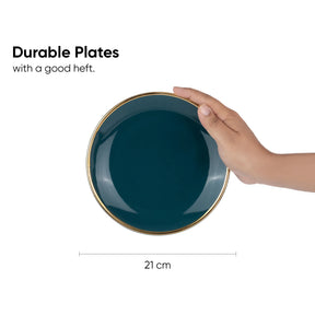 Teal plate with gold rim held by a hand, labeled 'Durable Plates with a good heft.' and '21 cm' for size.