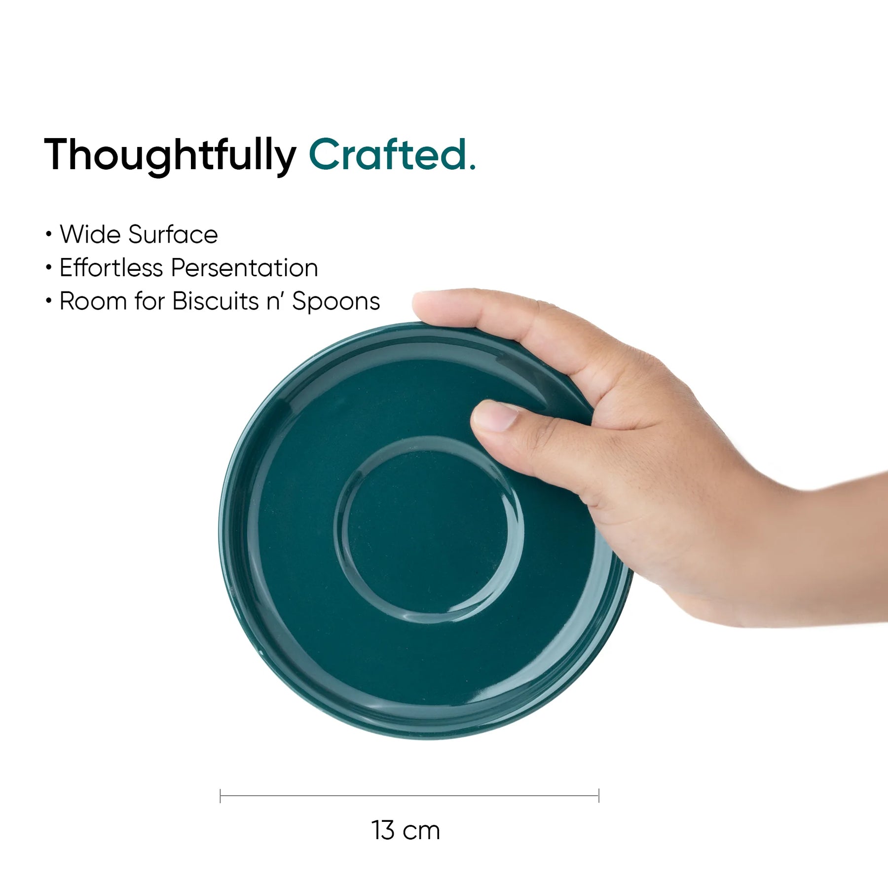 Teal ceramic plate held by a hand with text highlighting features on a white background