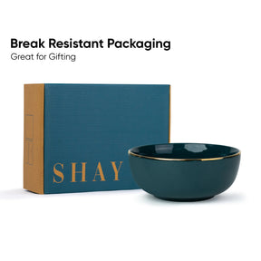 Teal bowl with gold rim and 'SHAY' branded box on a white background