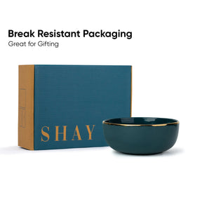 Teal bowl with gold rim and 'SHAY' branded box on a white background