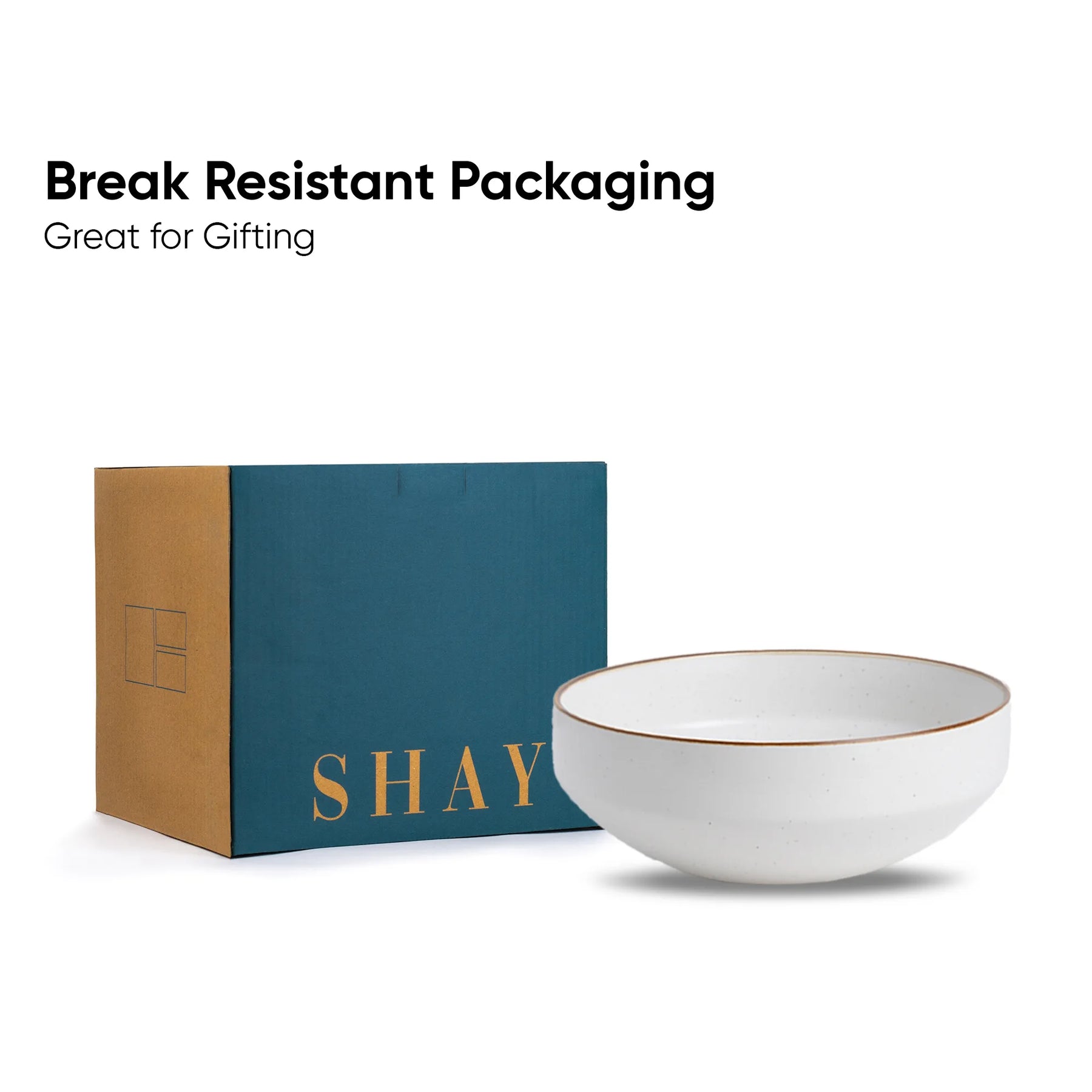 White bowl with gold rim and 'SHAY' branding next to a blue and brown box on a white background.