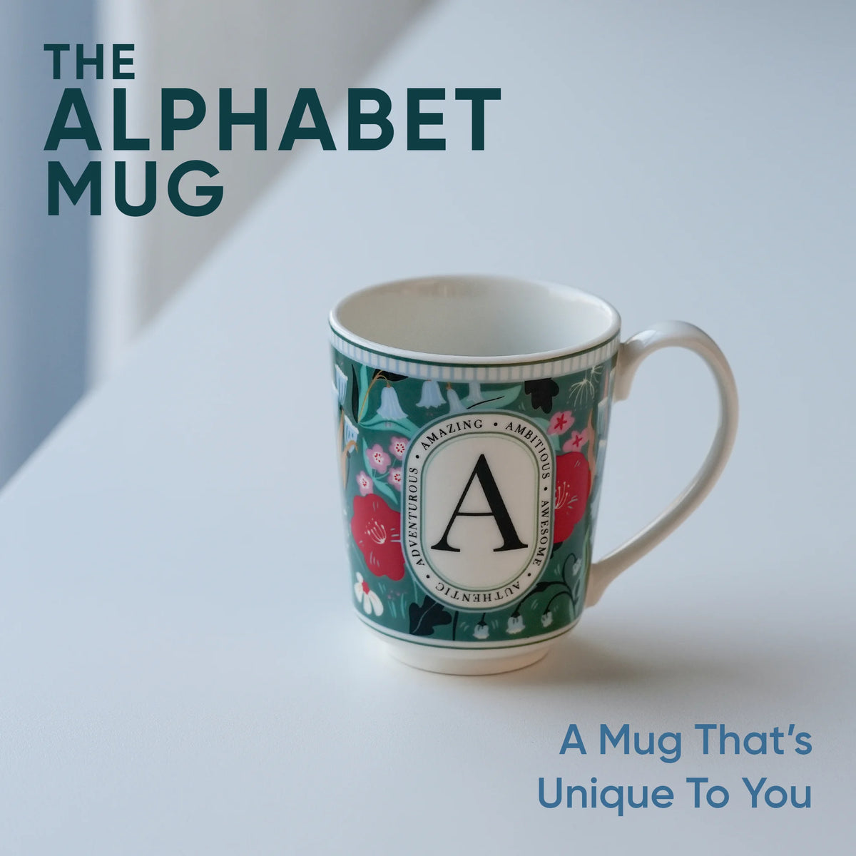 Mug with decorative design and letter 'A' on a light background