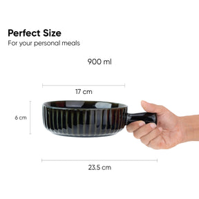 Black ceramic bowl held by a hand with measurements on a white background