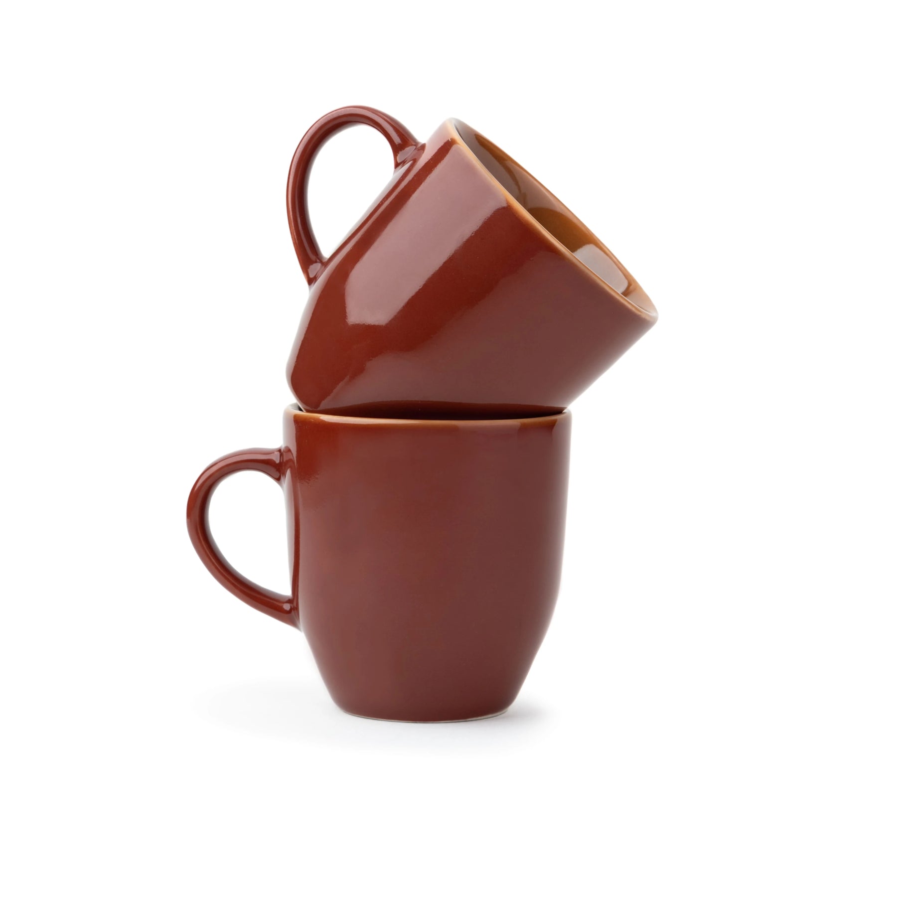 Two brown ceramic mugs stacked on a white background