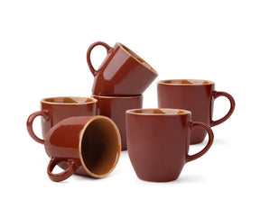 Set of brown ceramic mugs on a white background