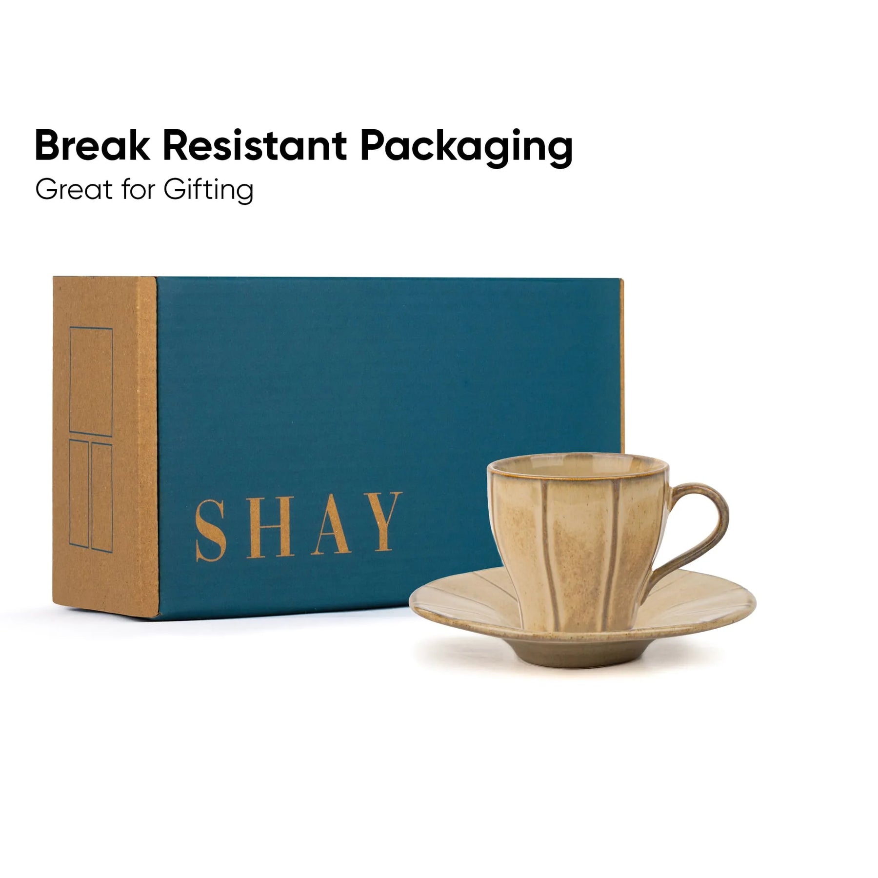 Ceramic cup and saucer with 'SHAY' branded box on a white background