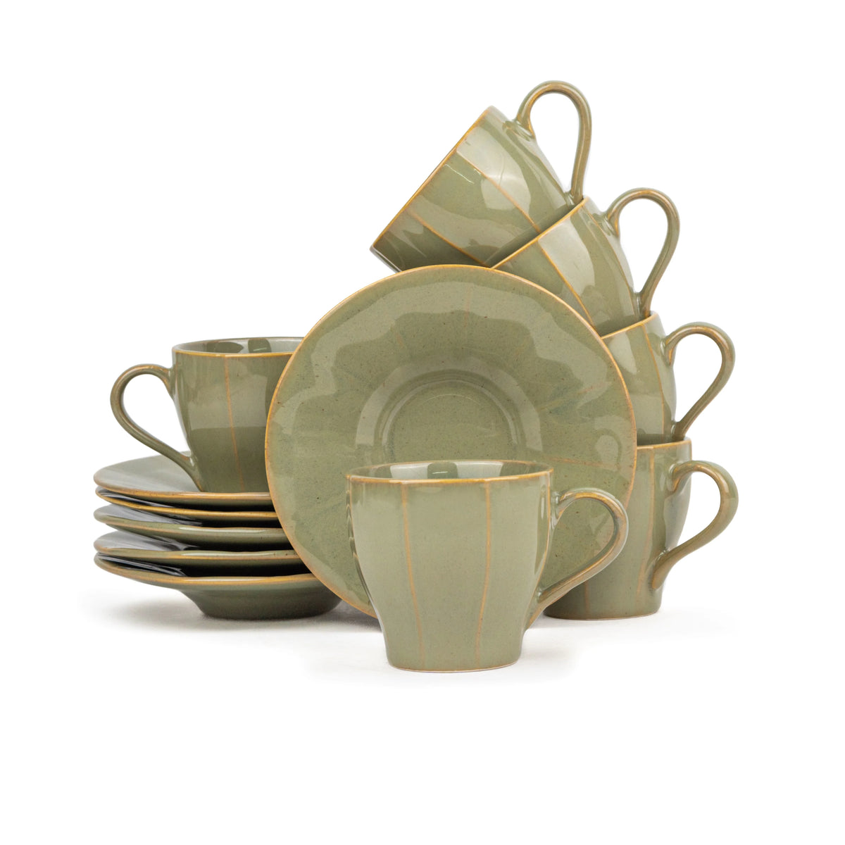 Green ceramic dinnerware set with gold trim on a white background