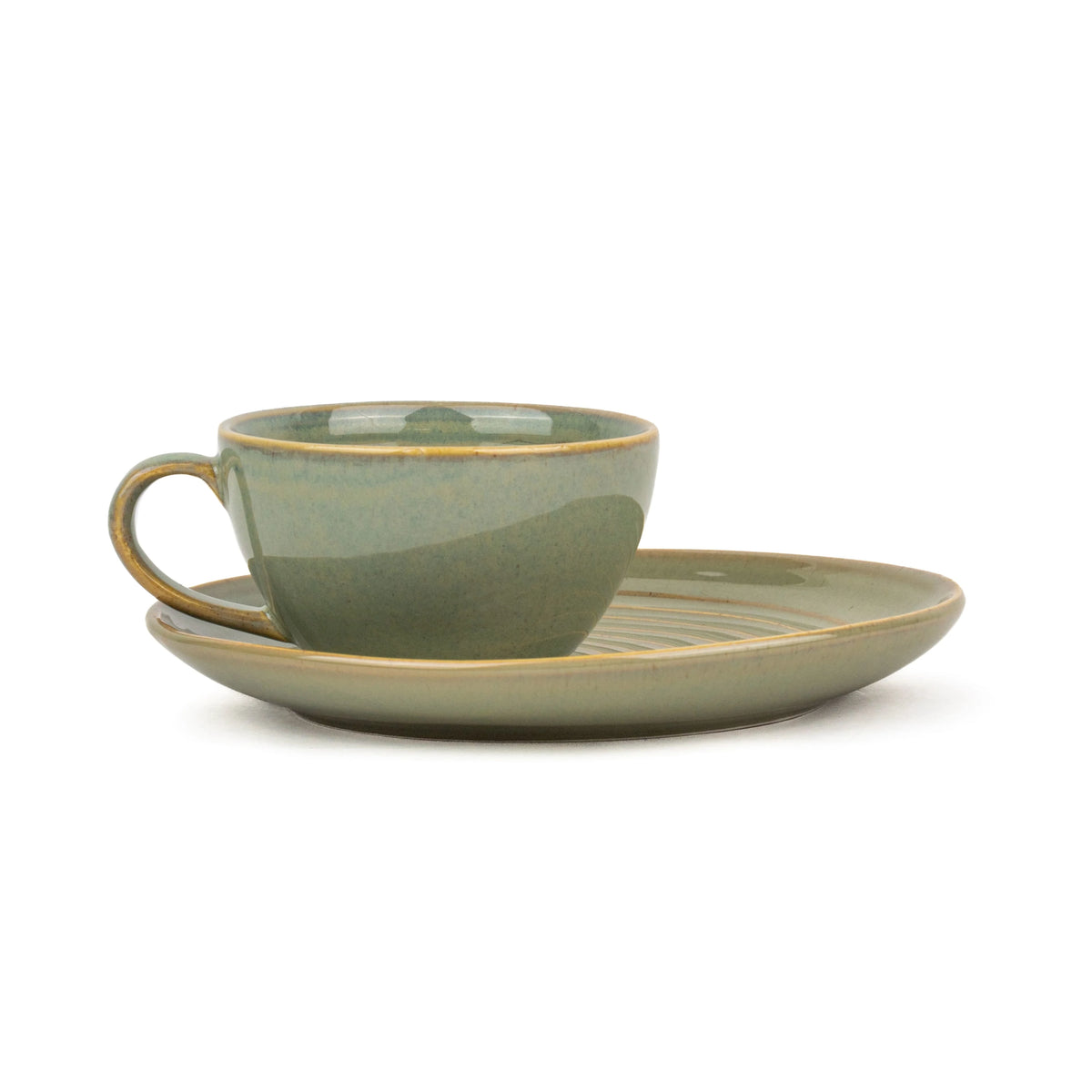 Green ceramic cup and saucer set on a white background