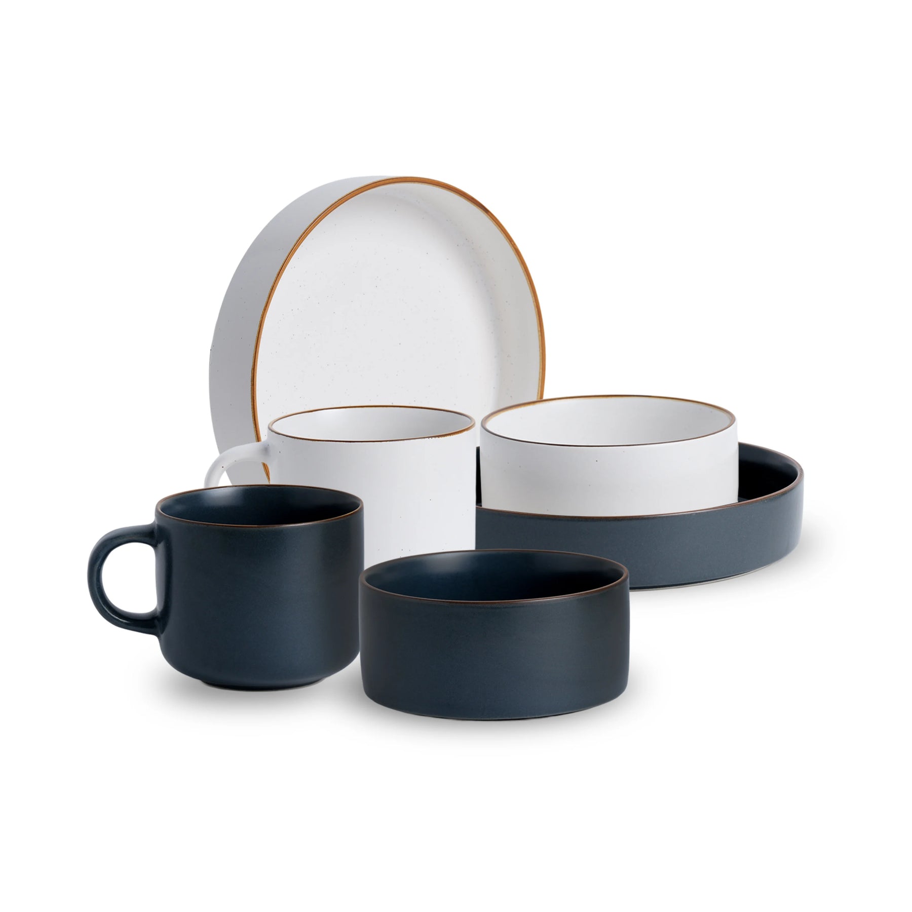 Ceramic dinnerware set with blue and white pieces on a white background