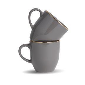 Two gray mugs with gold rims stacked on a white background