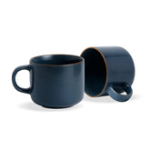 Two navy blue mugs on a white background