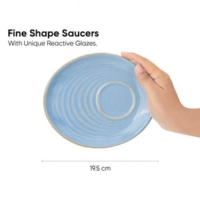 Blue ceramic saucer held by a hand with text about unique reactive glazes.
