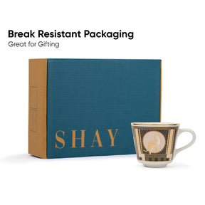 Teal box with 'SHAY' branding and a decorative mug on a white background