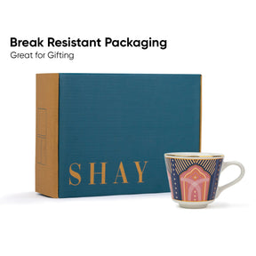 Teal box with 'SHAY' branding and a decorative mug on a white background