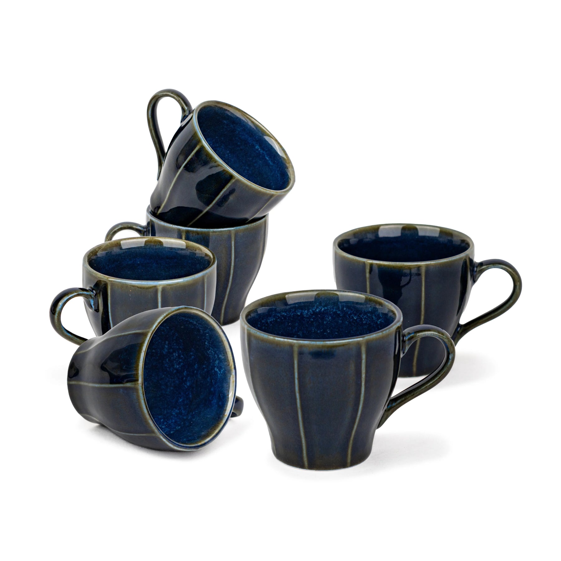 Set of six blue ceramic mugs on a white background