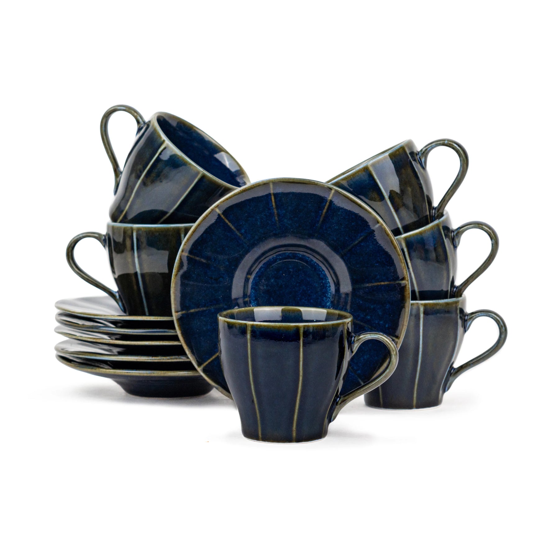 Set of blue ceramic dinnerware including cups and plates on a white background