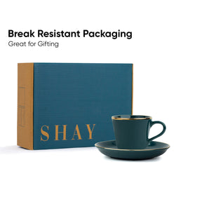 Teal cup and saucer set with 'SHAY' branded box on a white background
